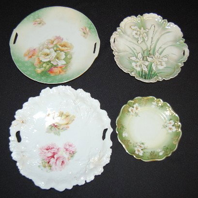 4 Floral RS Prussia China Plates: 4 Floral RS Prussia China Plates: 1.) Not molded, handled cake tray with open poppies décor. 2.) Large flower molded, handled plate with pink and yellow roses. 3.) Molded, handled plate with daffodil