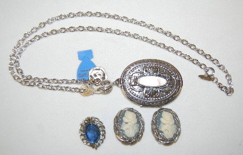 Whiting and Davis Necklace & Earrings: Whiting and Davis Jewelry: Necklace with a large locket with Mother of Pearl shell insert; one pair of cameo clip on earrings and a single clip on earring. All pieces have company tags.