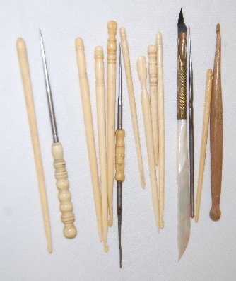 Antique Petit Point Needles: Ivory, Wood & Metal: Antique Petit Point Needles: Ivory, Wood & Metal: There are 6 ivory with fine hooks on one end and carved tops; 4" - 5" Long. There is also 1 wood, 1 steel and 2 ivory and steel; 3 ivory with pointed 