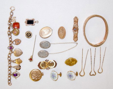 16 Pieces of Victorian Jewelry: Bracelets Plus: 16 Pieces of Victorian Jewelry: Bracelets Plus: Charm bracelet with 8 charms; there is a carved carnelian, padlock, heart, peace sign and others; a hinged bracelet (broken release); 3 small brooches; 