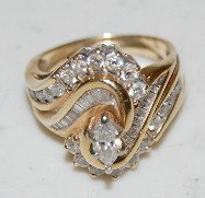14K Yellow Gold & Diamond Ladies Ring: 14K Yellow Gold & Diamond Ladies Ring, Size 6 1/4 - 6 1/2: the diamonds are in 3 cuts, round, baguette and solitaire. 8.1 Grams.