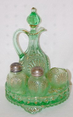 Green EAPG "Shell" Condiment Set: Green EAPG "Shell" Condiment Set: cruet, salt and pepper, oral pick holder and tray. (Shakers are rough on the rim under the lid; cruet has small nicks on rim; stopper may have been ground in places; 