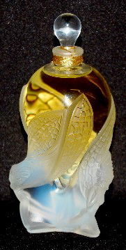 Lalique Art Glass "Les Elfes" Perfume Bottle, '02: Lalique Art Glass "Les Elfes" Perfume Bottle, '02: unopened; bottom label reads "1F15 Lalique Parfum Made in France"; incised Lalique, France and DO41; 2.5 Fluid Ounces. No condition problems. 6".