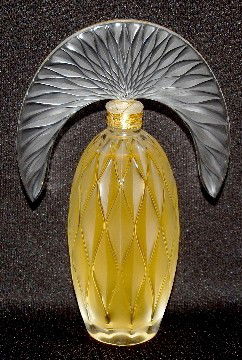 Lalique Art Glass "Comedia" Perfume Bottle, 2007: Lalique Art Glass "Comedia" Perfume Bottle, 2007: unopened; bottom label reads "6FAEF Lalique Parfums Made in France Parfum REF 21106"; incised Lalique, France and B705; 4.7 Fluid Ounces; with origina