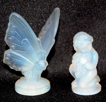2 Sabino Art Glass Statues, Butterfly & Cherub: 2 Sabino Art Glass Statues, Butterfly & Cherub: 1.) "Open Wing Butterfly" Statue, small; incised Sabino, France, 2 5/8". 2.) "Cherub", incised Sabino, France, 1 3/4". No condition problems.