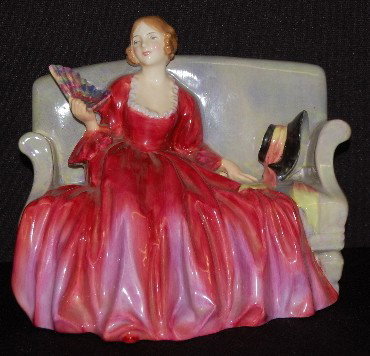 Royal Doulton Figurine Sweets Twenty, HN1298: Royal Doulton Figurine Sweets Twenty, HN1298: she sits on a blended color couch; wearing a red dress; green company stamp and title; painted HN number. No condition problems. 5 3/4" x 7 1/2".