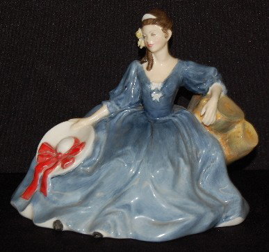Royal Doulton Figurine Elyse, HN 2429, 1971: Royal Doulton Figurine Elyse, HN 2429: 1971; she wears a blue gown and holds a white hat with red ribbon; green logo with title, date and RD numbers. No condition problems. 6" T.