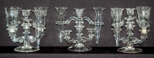 3 Elegant Depression Glass Candle Holders: 3 Elegant Depression Glass Candle Holders: "Floral Heart and Ribbon" pattern; two complete with vases and etched chimneys; the third has the vases but not the chimney. No condition problems to what we