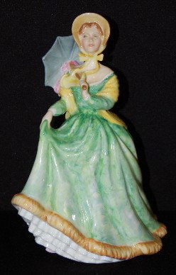 Royal Doulton Figurine Elizabeth, HN 2946, 1981: Royal Doulton Figurine Elizabeth, HN 2946: 1981; she wears a mottled green and yellow gown with a blue umbrella; green marks includes the title, HN, date and Royal Doulton Tableware. No condition prob