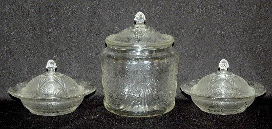 3 Crystal Depression Glass "Royal Lace" Dishes: 3 Crystal Depression Glass "Royal Lace" Dishes: 1.) Cookie jar, 2 7/8" mold mark in the bottom. 2.) 2 covered butters. Expected minor roughness to glass of this age. 7 1/2".