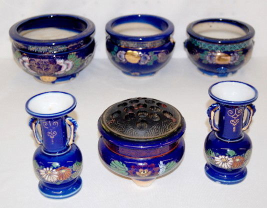 6 Cobalt Oriental Decorated Pots and Vases: 6 Cobalt Oriental Decorated Pots and Vases: 4 urns, different sizes; 2 vases and a black glass flower frog. (Small chip on the flower frog.) Tallest 5 1/4".