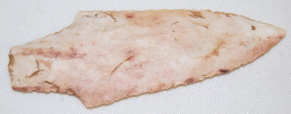 Stemmed Point, 4 3/8" Long: Stemmed Point, 4 3/8" Long: made from a pink and white granite like material.