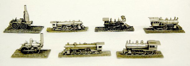 7 Pewter Train Engines, Danbury Mint: 7 Pewter Train Engines, Danbury Mint: 1.) ICRR 382 Cannonball Express; 5" L; with info; (the headlamp has been reattached.) 2.) The Chattanooga Choo-Choo No. 555; 5 3/8" L; no info. 3.) The DeWitt Cli