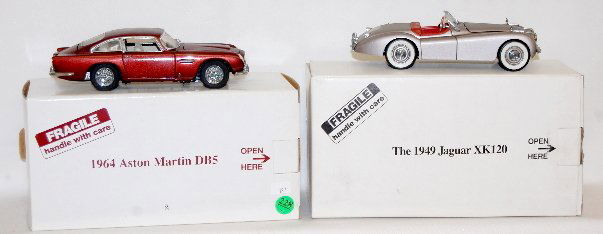 2 Die Cast Metal Cars, Aston Martin & Jaguar: 2 Die Cast Metal Cars: 1.) 1964 Aston Martin DBS, made in China, 7 1/2" 2.) 1949 Jaguar XK120, made in Korea, 7 1/4" All made for The Danbury Mint; with original boxes. Excellent condition. Circa Earl