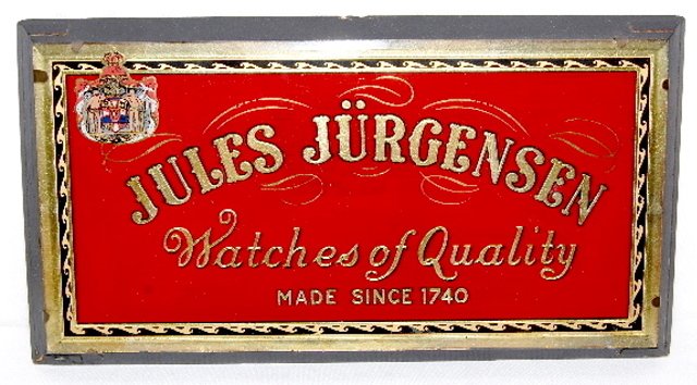 Reverse Painted Watch Advertising Sign: Reverse Painted Watch Advertising Sign: "Jules Jurgensen Watches of Quality, Made Since 1740"; paper tag on the back reads B & B Sign Company and a certificate of the Watch Makers. 7" T x 13" L (No co