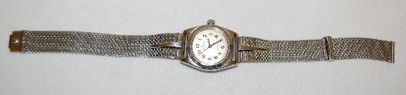 Rolex Oyster Perpetual Chronometer Wrist Watch: Rolex Oyster Perpetual Chronometer Wrist Watch: the silver dial has black specks on it; black hands, red seconds hand and black numbers, along with Swiss Made. Will not wind, not opened; stainless ste