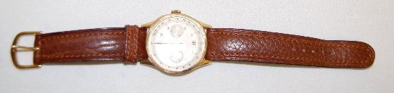 Angelus 18K Chronometer Wrist Watch: Angelus 18K Chronometer Wrist Watch: the silver dial has gold hands, silver markers and 2 smaller dials. On the yellow gold case back is the gold standards with sovereign head along with number 1375.