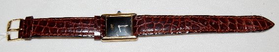 Cartier Wrist Watch, Sterling, No. 6 047358, SW: Cartier Wrist Watch, Sterling, No. 6 047358, SW: black, rectangular dial with white hands, on the back it reads "Cartier Paris .925; Argent Plaque Or G20M Swiss" and WH on 5 other small cartouches inc