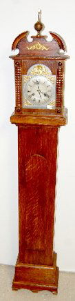 German 2 Train Oak Granddaughter Clock: German 2 Train Oak Granddaughter Clock: carved oak case; T & S; brass trim; signed Badische movement. 61 1/2" T x 10 1/2" W. *Please note, this item ships F.O.B. which means you, the buyer, must make