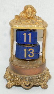 Plato Digital Clock With Lady Head: Plato Digital Clock With Lady Head: blue numerals, signed; circa 1903. 6". (No dome.)