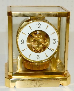 Jaeger Le Coultre Atmos Shelf Clock: Jaeger Le Coultre Atmos Shelf Clock: brass frame; white dial; 15J; Serial No. 371280; has a 1943-1973 Amaco Oil Company presentation tag.