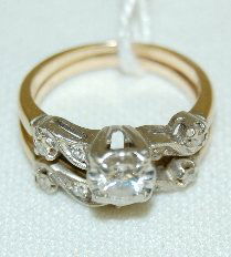 14K Gold Wedding Ring Set With Diamonds: 14K Gold Rings With Diamonds: The 2 yellow and white gold rings are neatly joined together at their bottoms. The largest diamond is 3/8 - 1/4ct; there are other small diamonds also. Size 6.5, weight 5