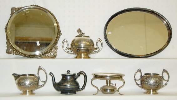 7 Pcs of Silver Plate, Plateaus, S&C, Tea Warmer: 7 Pieces of Silver Plate, Plateaus, S & C: Round and oval plateaus; matching sugar and creamer; odd sugar; odd creamer and a burner.