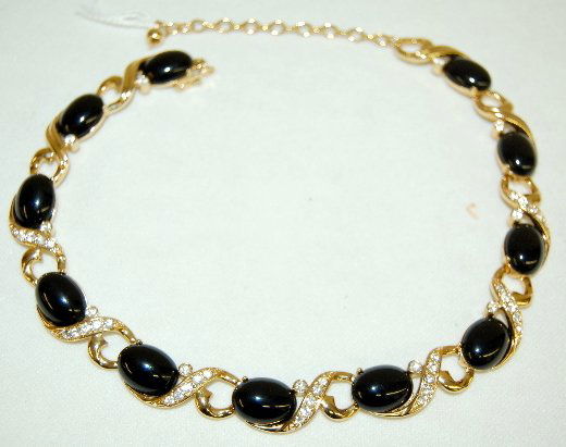 Trifari Necklace, Rhinestone & Black Stone: Trifari Necklace, Rhinestone & Black Stone: made in 11 joined segments set with rhinestones and oval jet colored material. This is an attractive piece of jewelry. Total length is 20". No condition pro