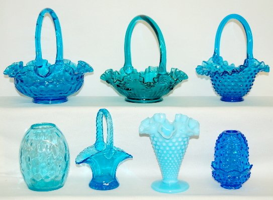 7pcs Fenton & Other Blue Glass, Baskets, Vases: 7 Pieces Fenton & Other Blue Glass: 1.) Fenton, bright blue honey comb basket, hobnail basket; hobnail fairy lamp and powder blue trumpet vase. Fairy lamp and trumpet vase are marked. 2.) Teal rose pa