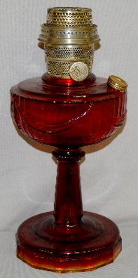 Aladdin B-77 Ruby "Tall Lincoln Drape" Lamp: Aladdin B-77 Ruby "Tall Lincoln Drape" Lamp: Model b burner; crow feet design under base; 2" factory made straw mark on the top of the base. 14" T No condition problems.