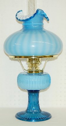 Fenton Aladdin 1994 Grand Vertique Table Lamp: Fenton Aladdin 1994 Blue Grand Vertique Table Lamp: No. 14 of 500 made. Complete with burner, mantle, chimney, 10" cased shade; original box. 22" T w/ shade. No condition problems.