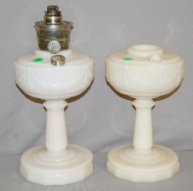 2 Aladdin B-75 Alacite Tall Lincoln Drape Lamps: 2 Aladdin B-75 Alacite "Tall Lincoln Drape" Lamps: 1.) Ivory alacite with a pink tint; Model B burner; plain base design. 2.) Ivory alacite, no burner or fill cap; plain base design. Both 10 1/4" T No