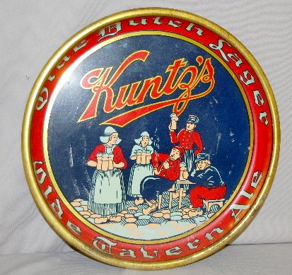 Kuntz's Tin Litho Beer Tray, Olde Dutch Lager: Kuntz's Tin Litho Beer Tray, Olde Dutch Lager, Olde Tavern Ale; depicting tavern scene with Dutch men and women serving and drinking ale. 13" Dia. (Some scratches and wear.)