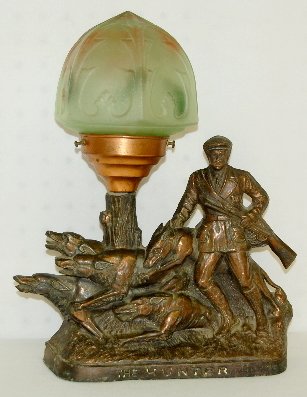 Art Deco Hunter & Dog Statue Lamp W/ Shade: Art Deco Hunter & Dog Statue Lamp W/ Shade: Copper clad white metal with green glass shade. (Minor roughness.)