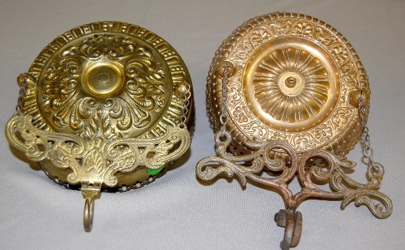 Brass Hanging Lamp Extension Fixture: Brass Hanging Lamp Extension Fixture: pierced and ornate brass w/ 2 chains, bar and hook to hang lantern from; chain not extended. Appears to be complete. 7 1/2"dia. x 2 1/4"T x 7 3/4" Chain extended 