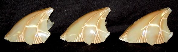 3 Art Deco Glass Wall Lamp Shades: 3 Art Deco Glass Wall Lamp Shades: flared shell shape in ivory and copper colors. 8" T x 4 3/4" W. (No mounting brackets.)