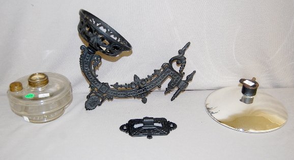 Bracket Lamp With Cameo Head and Crosses: Bracket Lamp With Cameo Head and Crosses: Cast iron wall mount; clear glass font; mercury reflector. 12 1/2" x 11". (No burner.)