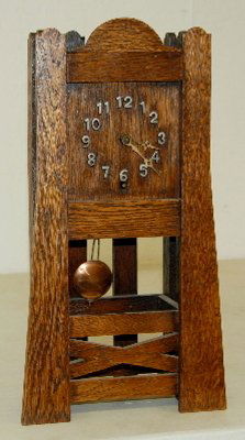 Mission Oak Shelf Clock, Time Only: Mission Oak Shelf Clock, Time Only: w/ pendulum; raised metal numbers. 14 3/4"T x 8"W No condition problems.