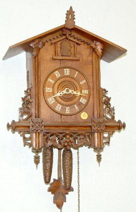 Carved German 2 Weight Cuckoo Clock: Carved German 2 Weight Cuckoo Clock: Carved with fruit and leaves; gong strike with bellows, has pendulum. Not tested. 17" x 13"(w/pendulum)