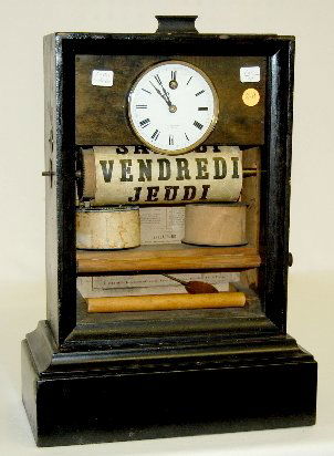 French 30 Day Calendar Clock, A. Paris, Brevete: French 30 Day Calendar Clock, A. Paris, Brevete: With a porcelain dial marked "A.E. Bremond A. Cette" in a painted wood case with lift out glass and a nice label on the door. Not tested. (There are so