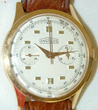 Angelus 18K Chronometer Wrist Watch: Angelus 18K Chronometer Wrist Watch: the silver dial has gold hands, silver markers and 2 smaller dials. On the yellow gold case back is the gold standards with sovereign head along with number 1375.