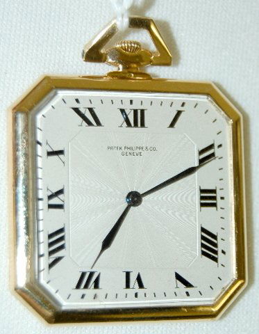 Patek Philippe & Cie 18K, No. 2330 Pocket Watch: Patek Philippe & Cie 18K, No. 2330 Pocket Watch: the movement, with 2 Geneve seals in is small compared to the much larger yellow gold, octagonal case. The silver dial with black Roman numerals looks
