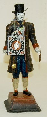 Metal Clock Peddler in Top Hat: Metal Clock Peddler in Top Hat: carrying a clock in front and on his back with pendulums dangling from his left hand; cast iron, not marked. 14 3/8" T