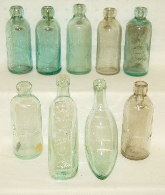 9 Antique Nebraska & Kansas Blob Glass Bottles: 9 Antique Clear, Aqua & Green Blob Glass Bottles: 1.) Standard Bottling Works, Seward Nebraska aqua bottle with partial Hutchinson stopper. 2.) Ross's Belfast green rounded bottom bottle; owner's note
