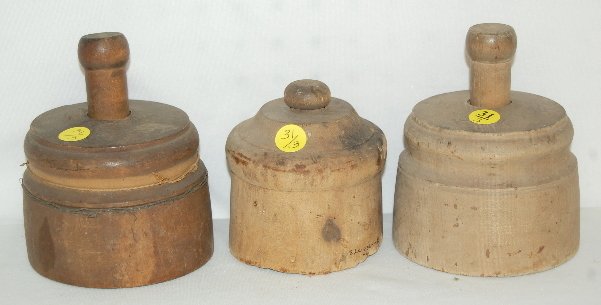 3 Antique Wooden Butter Molds, Pineapple: 3 Antique Wooden Butter Molds: 1.) Pineapple. (the wood has split and has a wire wrapped around it.) 2.) Flower w/ a leaf and bud branch. (rough bottom edge.) 3.) Sheaf of wheat. Largest 4 3/4" Dia.