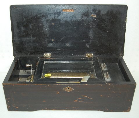 Antique Swiss Music Box, 51/4" Comb, 36 Teeth: Antique Swiss Music Box, 51/4" Comb, 36 Teeth: Painted black with a stencil on the top. Sounds nice. (The case is nicked; the paint is chipped; the lid latch is broken. Sometimes you have to spin the 