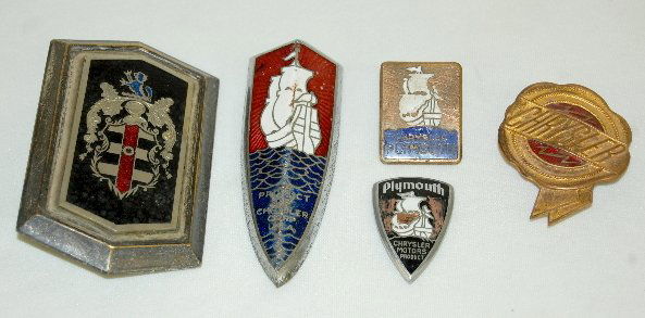5 Antique Chrysler & Dodge Car Emblems: 5 Antique Chrysler & Dodge Car Emblems: 1.) Dodge shield - no name - depicting the lion, knights helmet and shield; screw back. 2.) 1 Chrysler shield shape bent back to for a V w/ a ship and the words