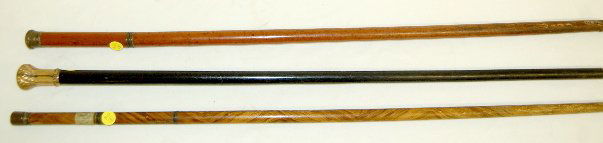 3 Antique Walking Canes, Glass Vial, + Others: 3 Antique Walking Canes: 1.) Wob & Co. Gold Rolled Plate Walking Cane - ornate metal pressed gold plate head on a black cane with a metal wrapped end; the head is marked; 35" L. 2.) Bottle Cane - the