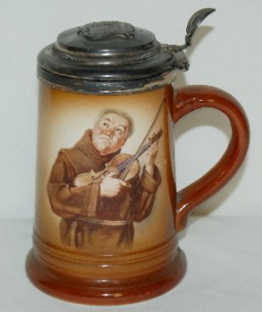 "Niagra" Souvenir Porcelain Stein, Monk w/ Violin: "Niagra" Souvenir Porcelain Stein, Monk w/ Violin: transfer design "Souvenir of Prospect Point, Niagara" with a monk playing a violin; w/silver-plate lid; unmarked. 6 1/2" Tall. (The lid is tarnished.