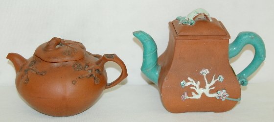 2 Chinese I'Hsing (Yixing) Teapots: 2 Chinese I'Hsing (Yixing) Teapots: 1.) Early w/ stubby spout and a scattering of branches and blossoms; this one shows use inside and out; has no damage and the lid's inside has an impressed figure o
